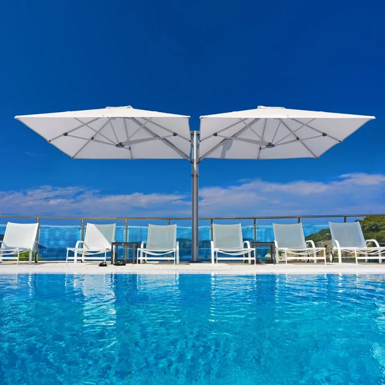 Premium Umbrellas next to pool on Waiheke Island - Waiheke Blinds and Awnings - Outdoor Shading Solutions