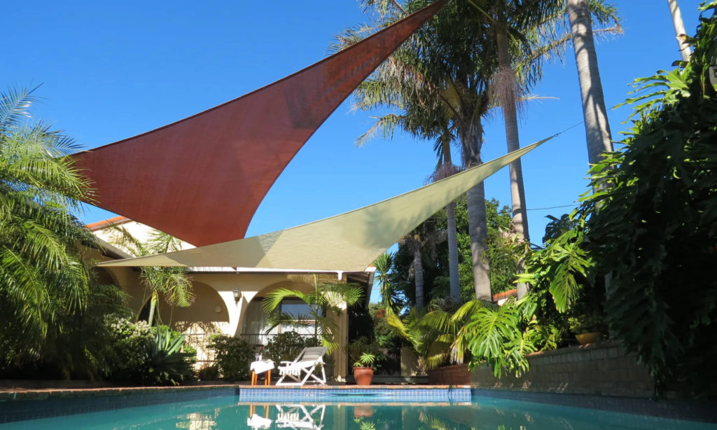 Customisable sun shade over pool on Waiheke Island - Waiheke Blinds and Awnings - Outdoor Shading Solutions